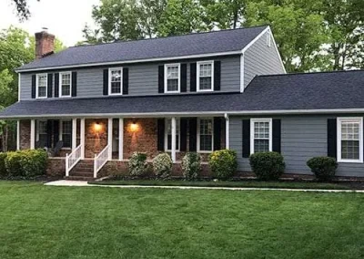 Two story home in Richmond, VA, with a quality asphalt roof installed by A Plus Roofing.