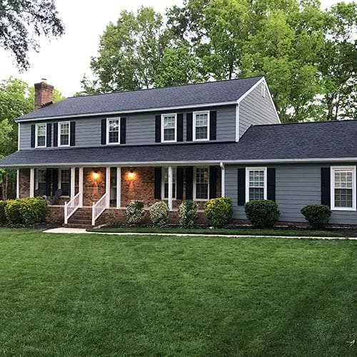 Two story home in Richmond, VA, with a quality asphalt roof installed by A Plus Roofing.