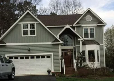 Siding installation in Richmond VA on a two-story home with updated exterior and trim.