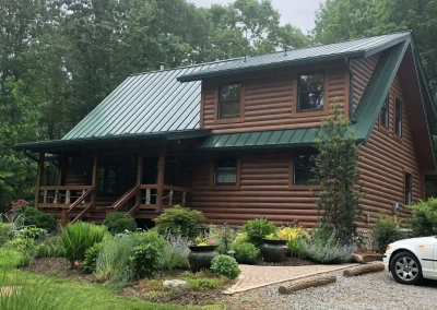 Finished residential metal roof replacement showing standing seam panels and trim in Richmond, Virginia